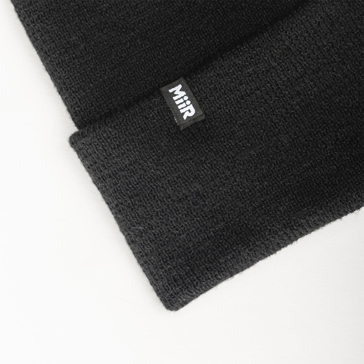 recycled-poly-fine-knit-beanie-t8 WebPDP-RecycledPolyFineKnitBeanie_Studio_TagDetail_Black__BNE005002OS.jpg