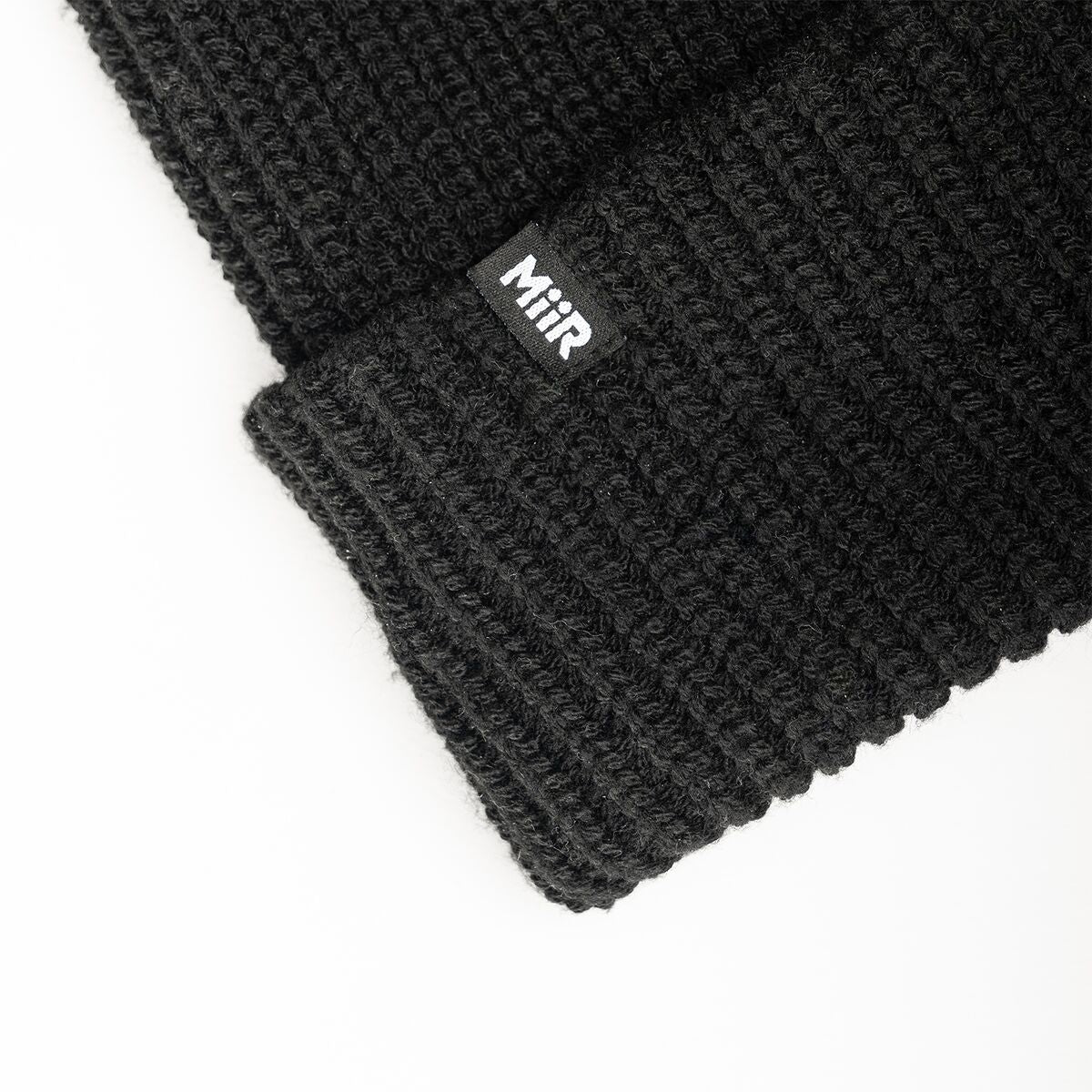 recycled-poly-rib-beanie-w2 WebPDP-RecycledPolyRibBeanie_Studio_TagDetail_Black__BNE002002OS.jpg
